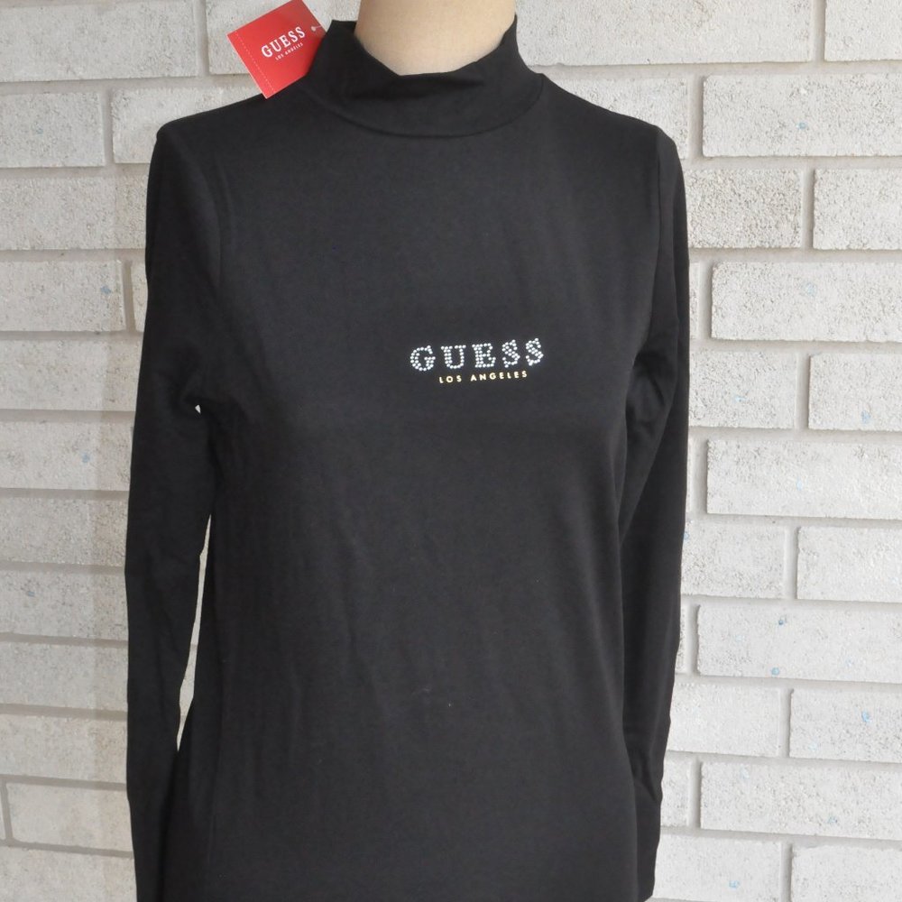 Guess black long sleeved Sydney mock turtle neck with rhinestone branding.  NWT